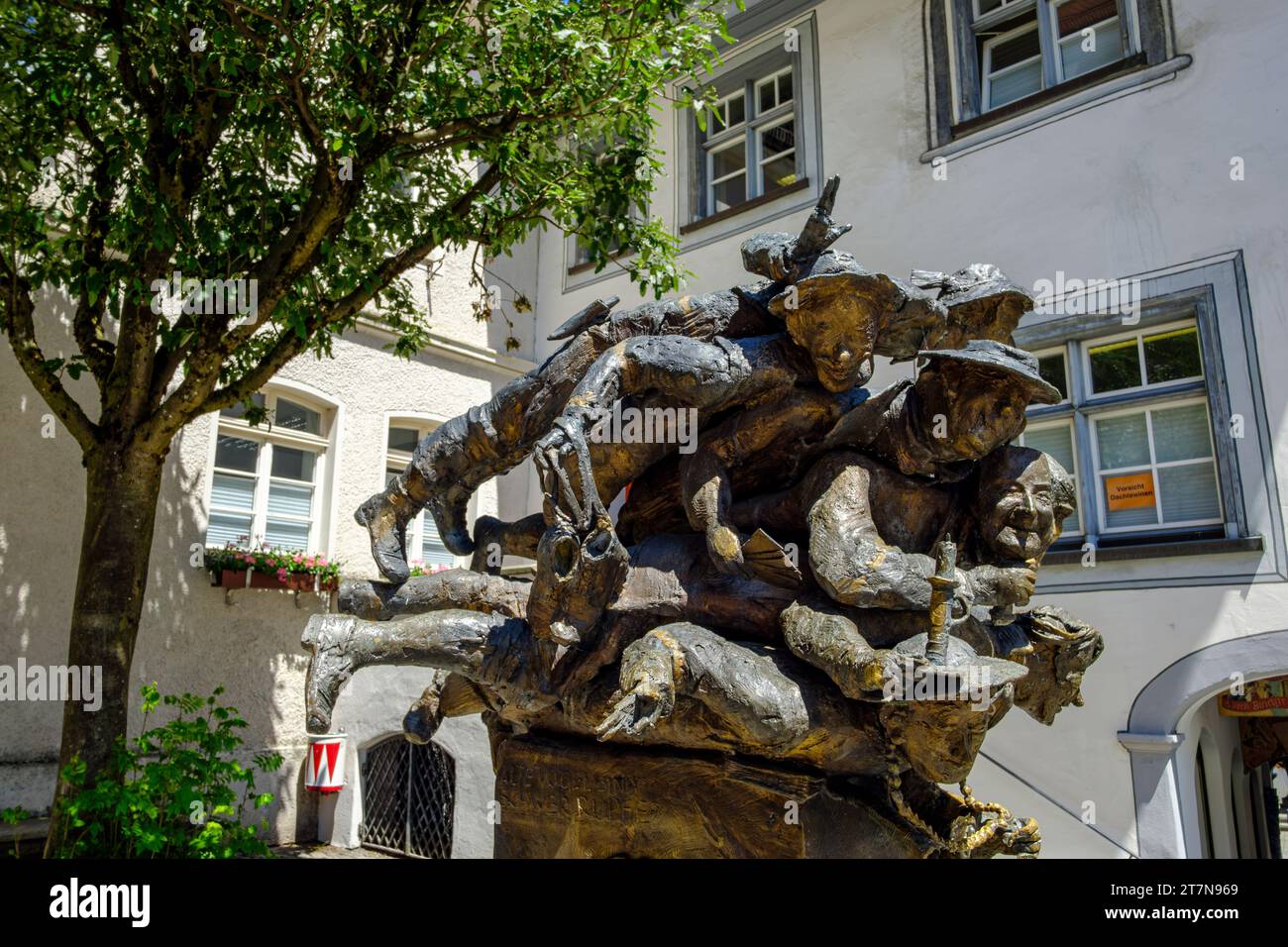 Spitting fountain with sculpture group 'Die verdruckten Allgäuer' by Joseph Michael Neustifter in the Old Town of Wangen, Upper Swabia, Germany. Stock Photo