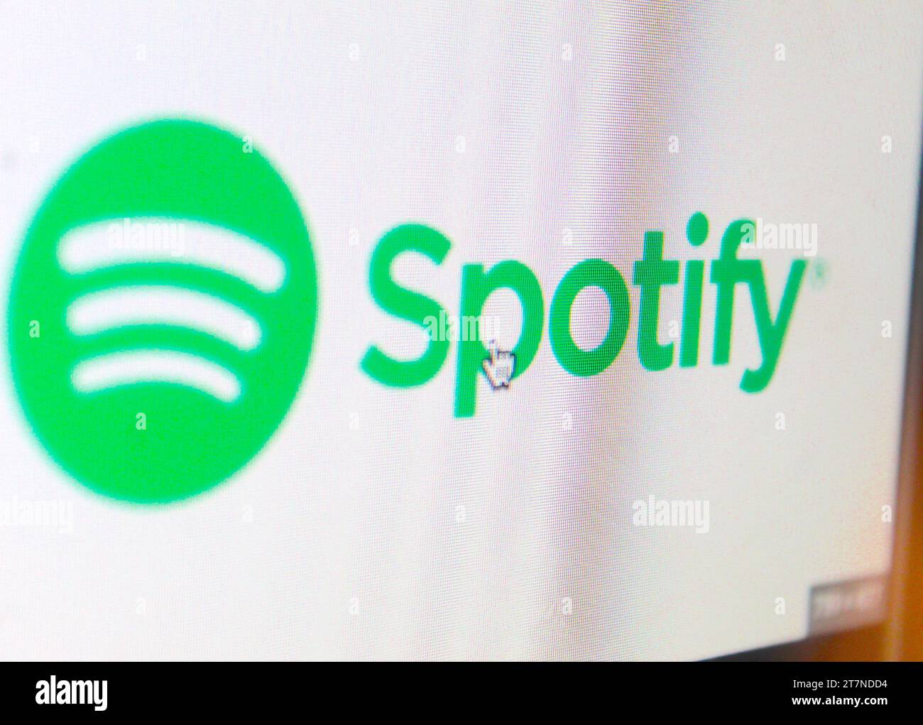 A photo of the green and white Spotify logo on a computer screen. Stock Photo