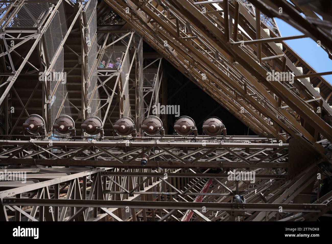 Details of the metal structure of the Eiffel Tower with its many cross beams. An abstract and contrasting photo that highlights the delicate and compl Stock Photo