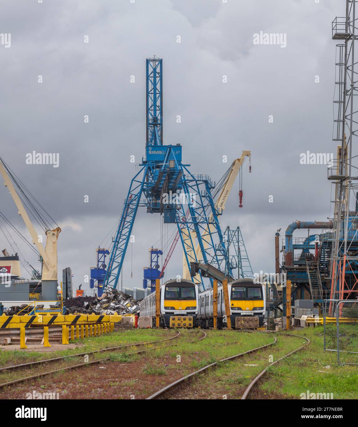 Scrap class 321 electric multiple unit trains waiting to be broken up and recycled at SIMS metals, Newport docks, South Wales, UK Stock Photo