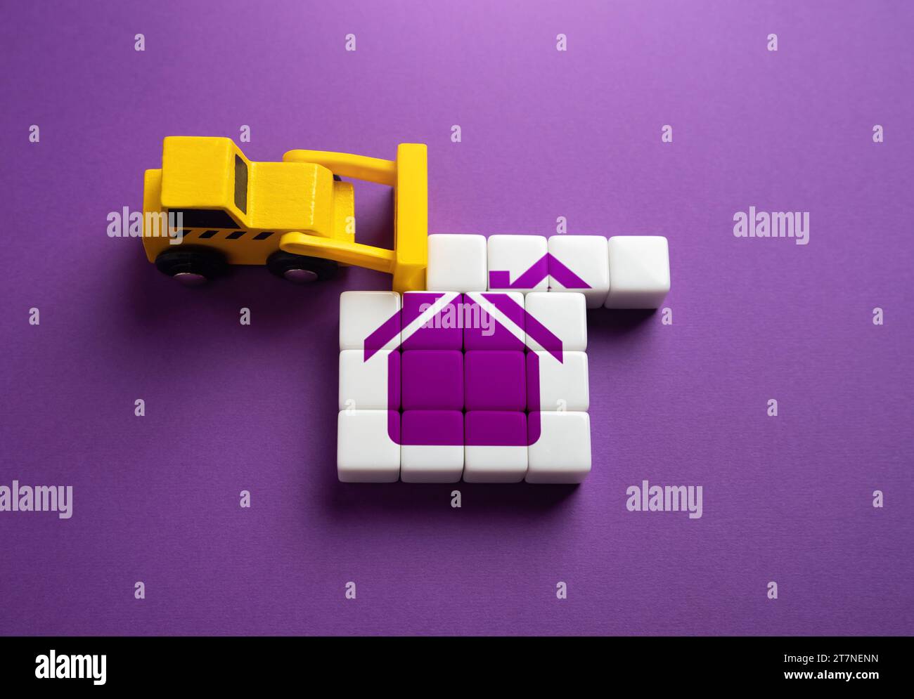 Removing the roof of a house. Concept. The bulldozer is about to