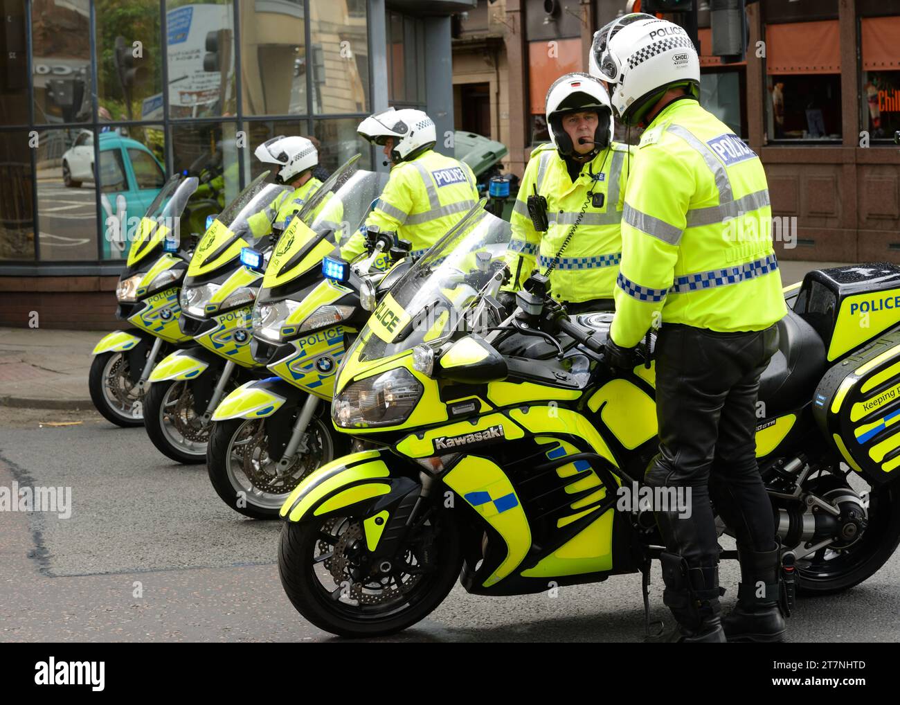 Scottish Motorcycle Police wearing high visibility clothing close a