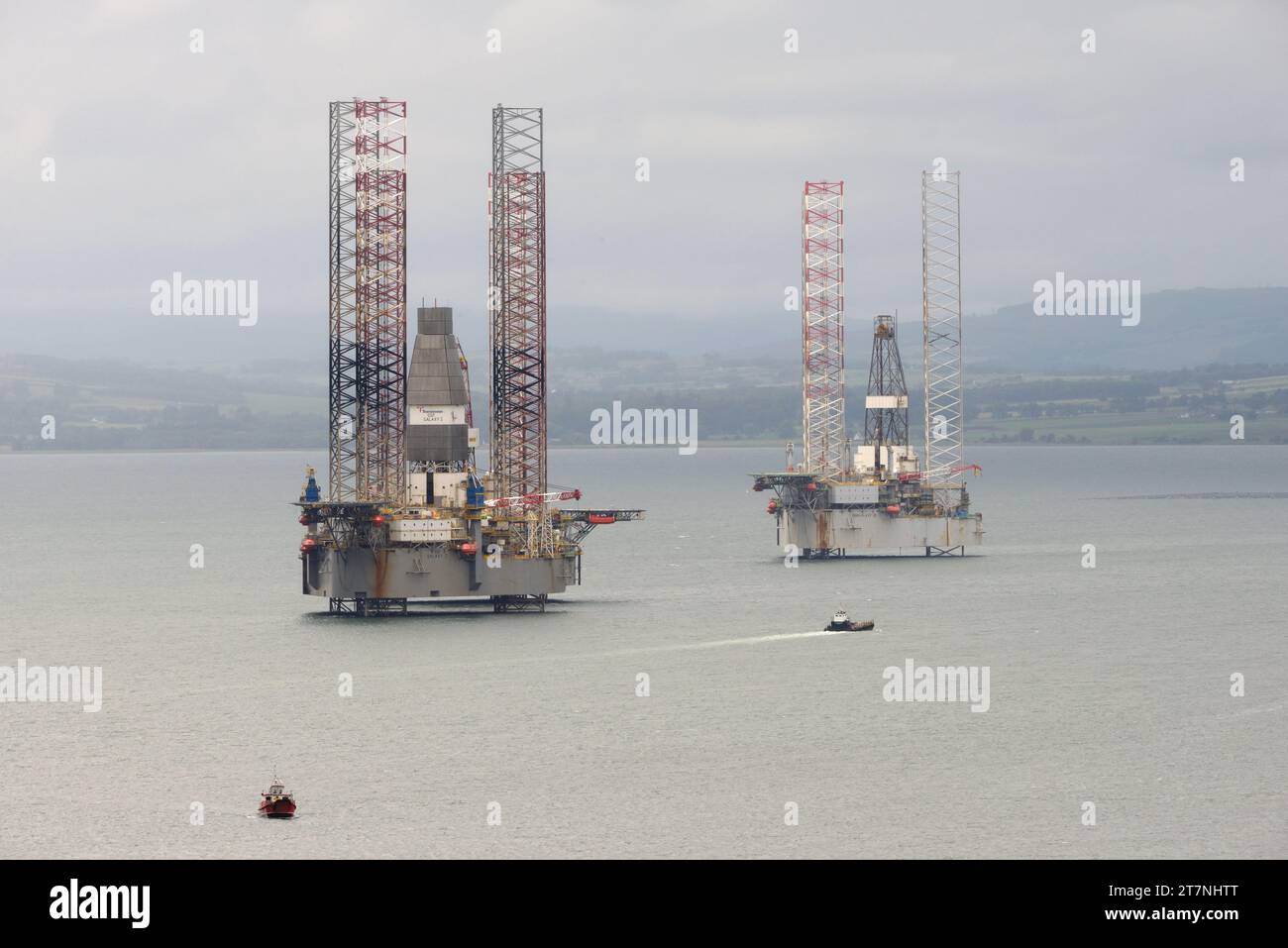 Oil and gas rigs sit in the Cromarty Firth in north east Scotland whilst out of commission. Stock Photo
