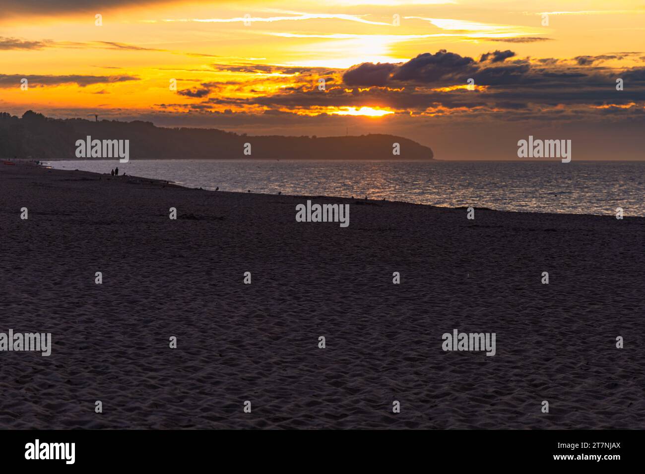 Beautiful dark golden sunset at golden hour at the beach next to dark ...