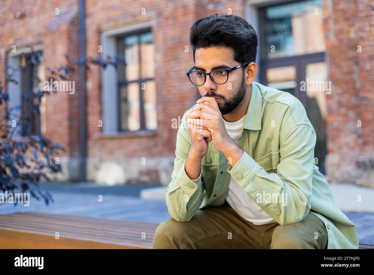 Sad student sitting on bench hi-res stock photography and images - Alamy