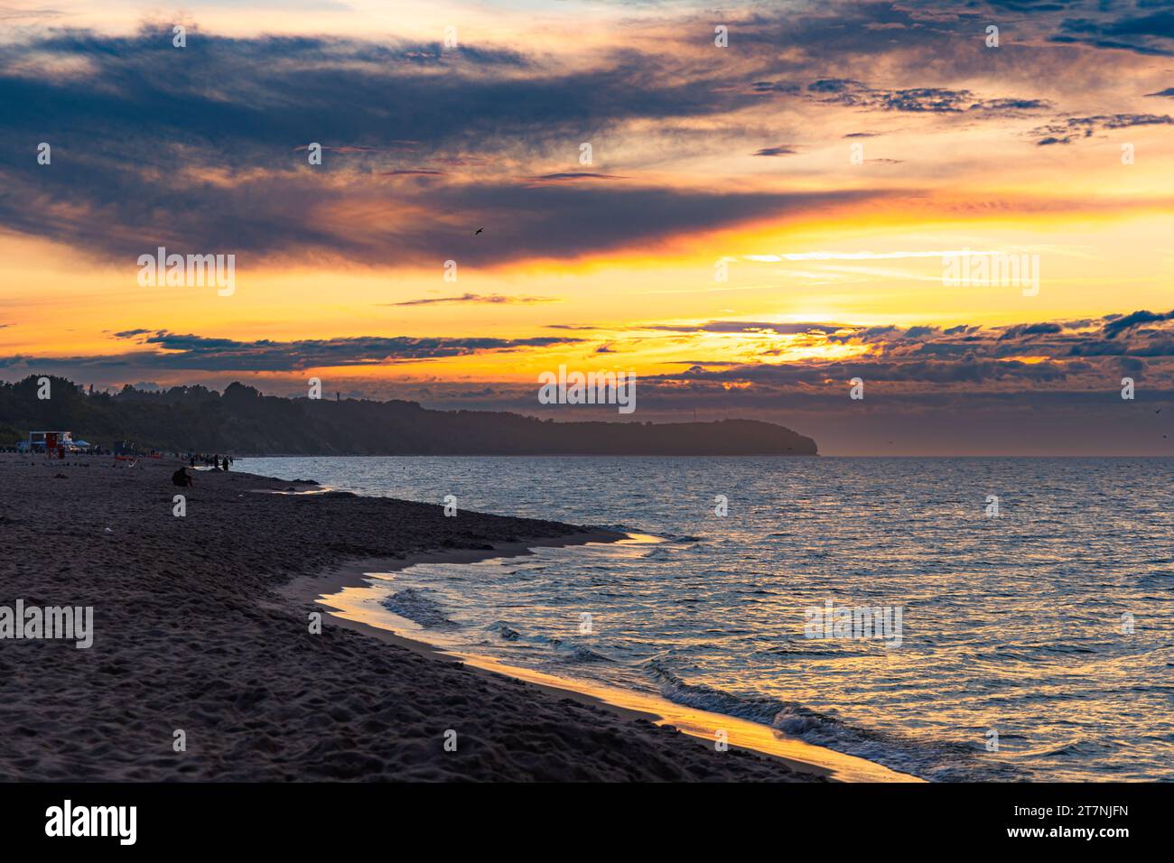 Beautiful dark golden sunset at golden hour at the beach next to dark ...