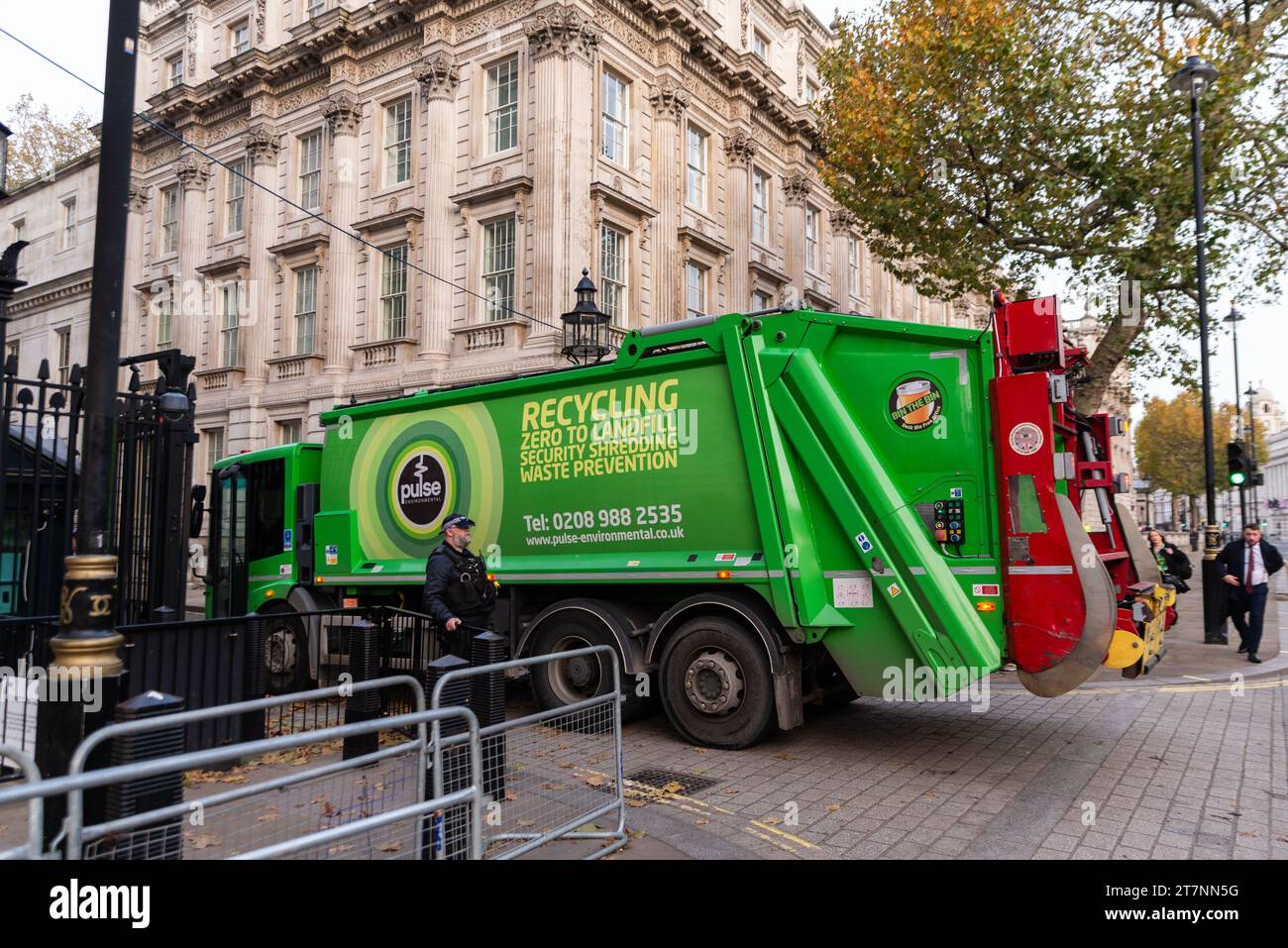 Rubbish collection lorry entering Downing Street off Whitehall, Westminster, London, UK. Home of Prime Minister. Recycling truck Stock Photo