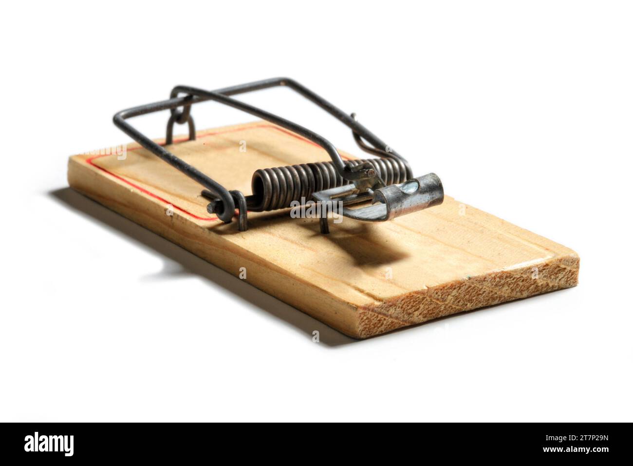 An inexpensive wood mousetrap, set to capture it's victim. Stock Photo