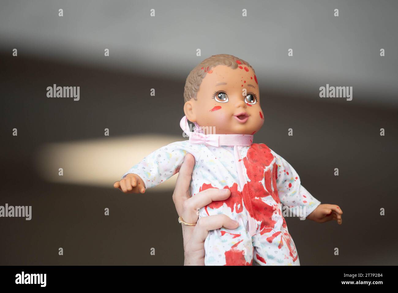 A doll covered in fake blood is held up while CODEPINK protesters gather with pro-palestinian protesters calling for a ceasefire in Gaza in the Hart Senate office building on Thursday, November 16, 2023.Credit: Annabelle Gordon/CNP /MediaPunch Stock Photo