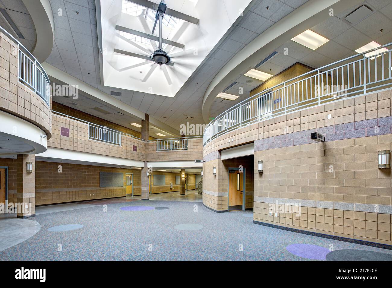 The main hallway in an elementary school, with money saving cnstruction materials, high efficency computer controlled LED light fixtures, and a large Stock Photo
