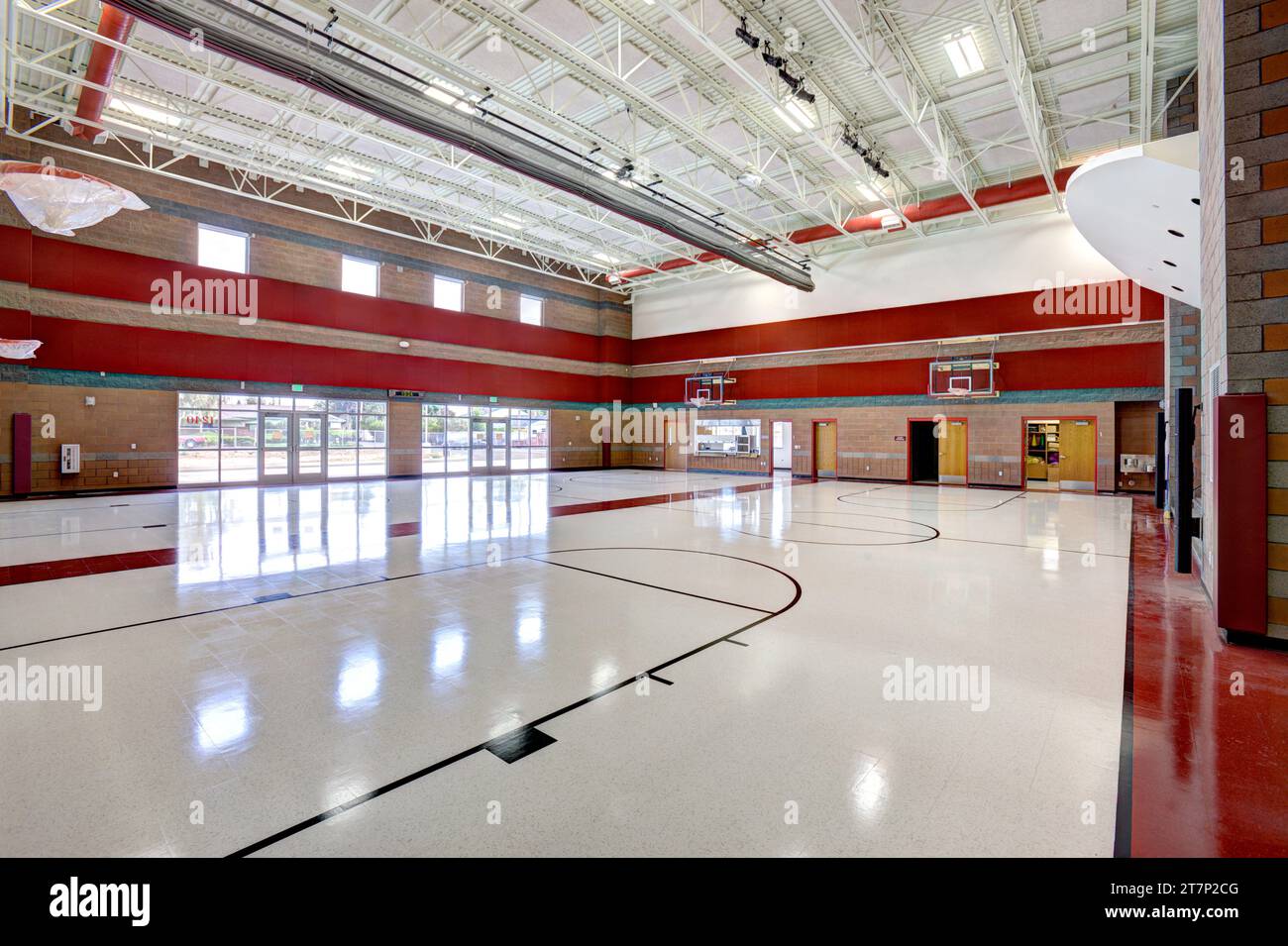 The multipurpose room in a modern new elementary school, which functions as a gym, lunchroom, meeting room, and theater. Stock Photo