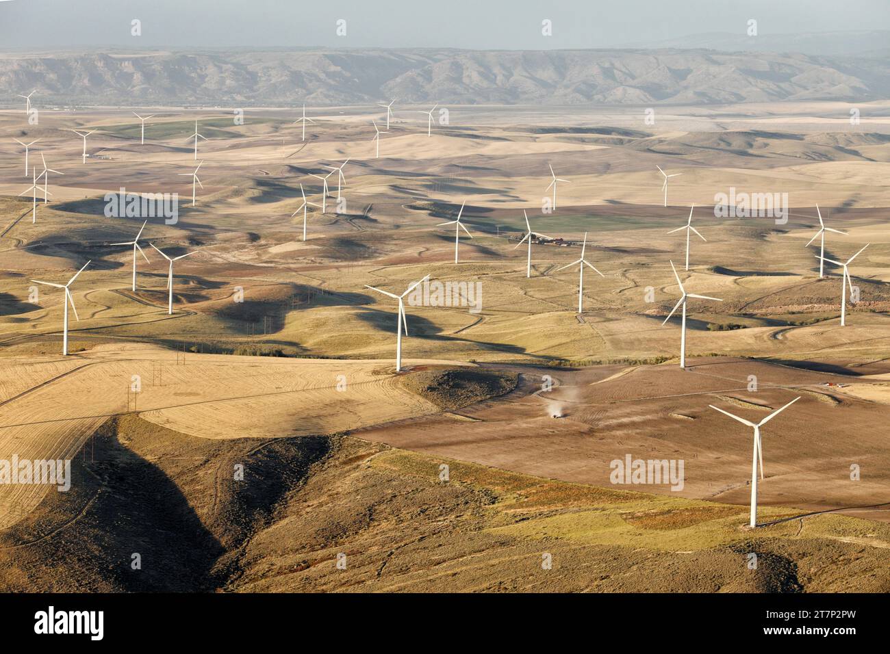 An aerial view of a group of ecologically friendly wind generators that scar the Idaho landscape. Stock Photo