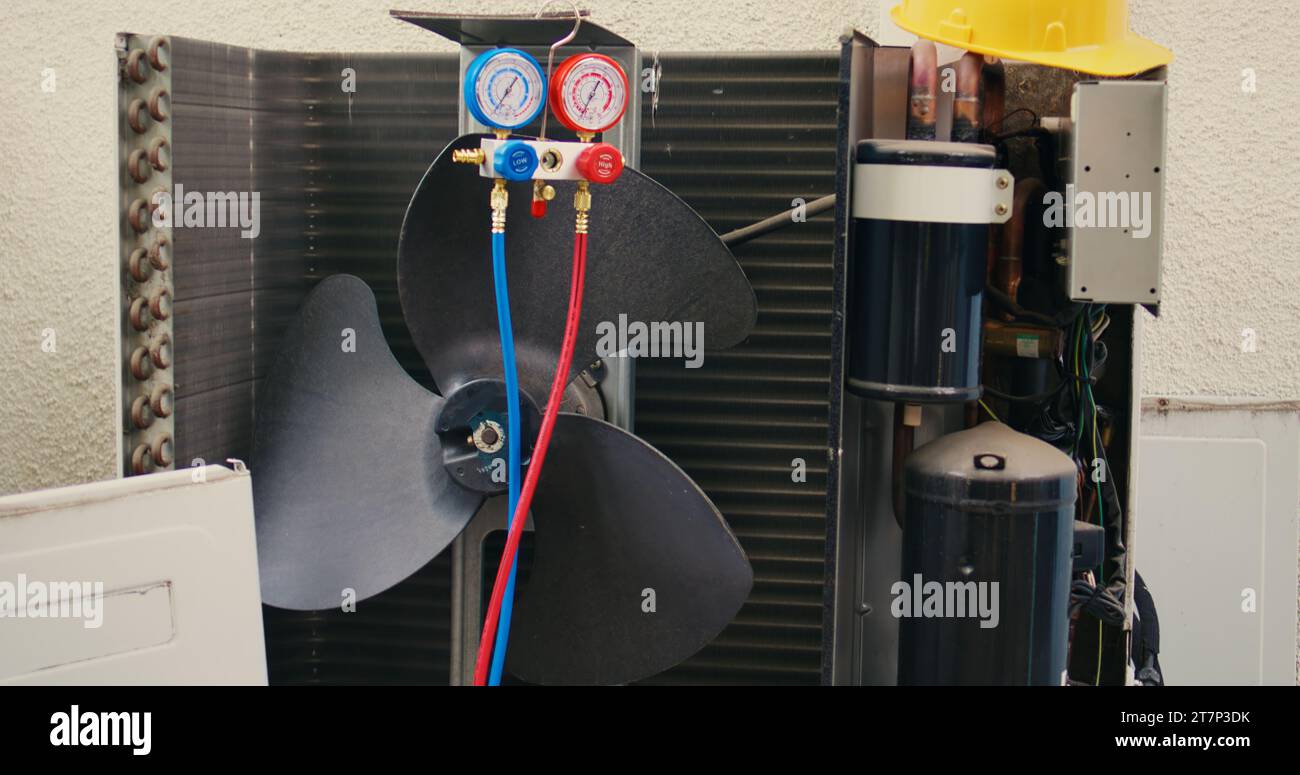 Jib down close up of manifold meters used for checking air conditioner