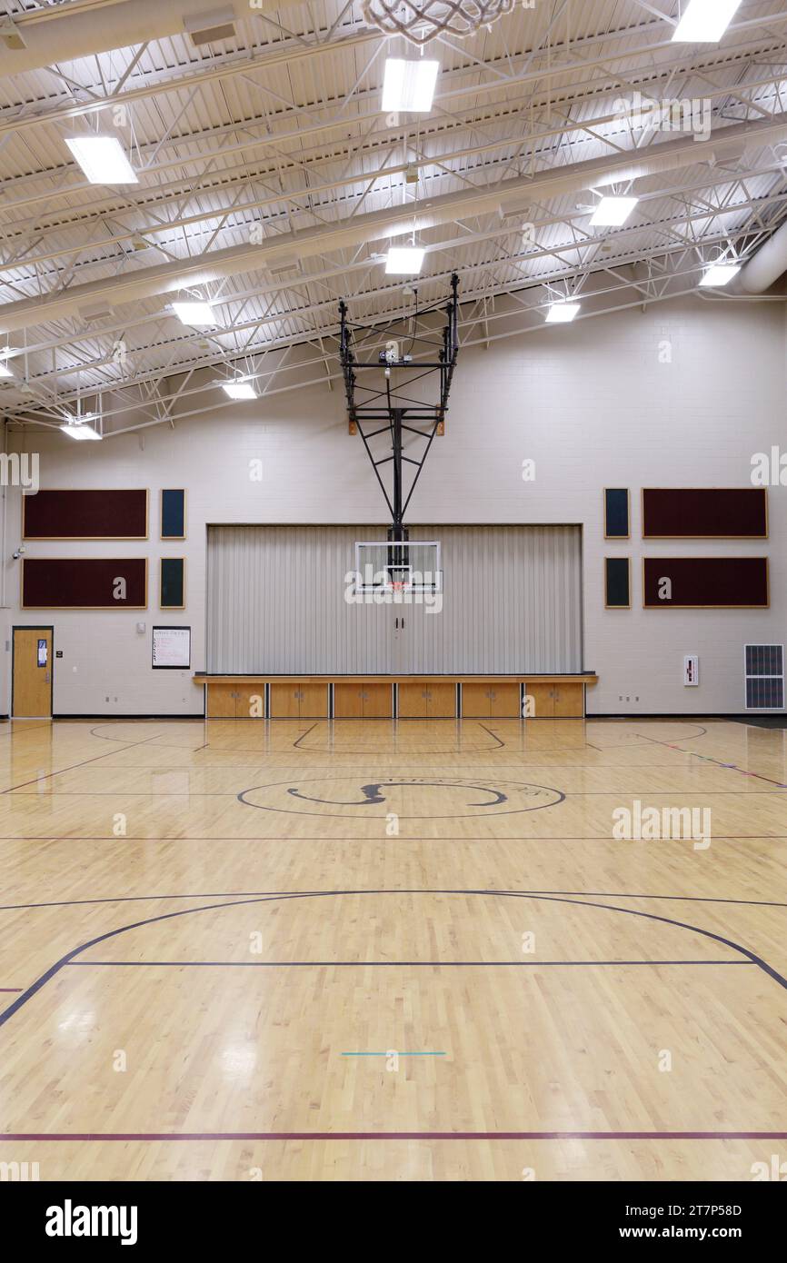 The multipurpose room in a modern new elementary school, which functions as a gym, lunchroom, meeting room, and theater. Stock Photo