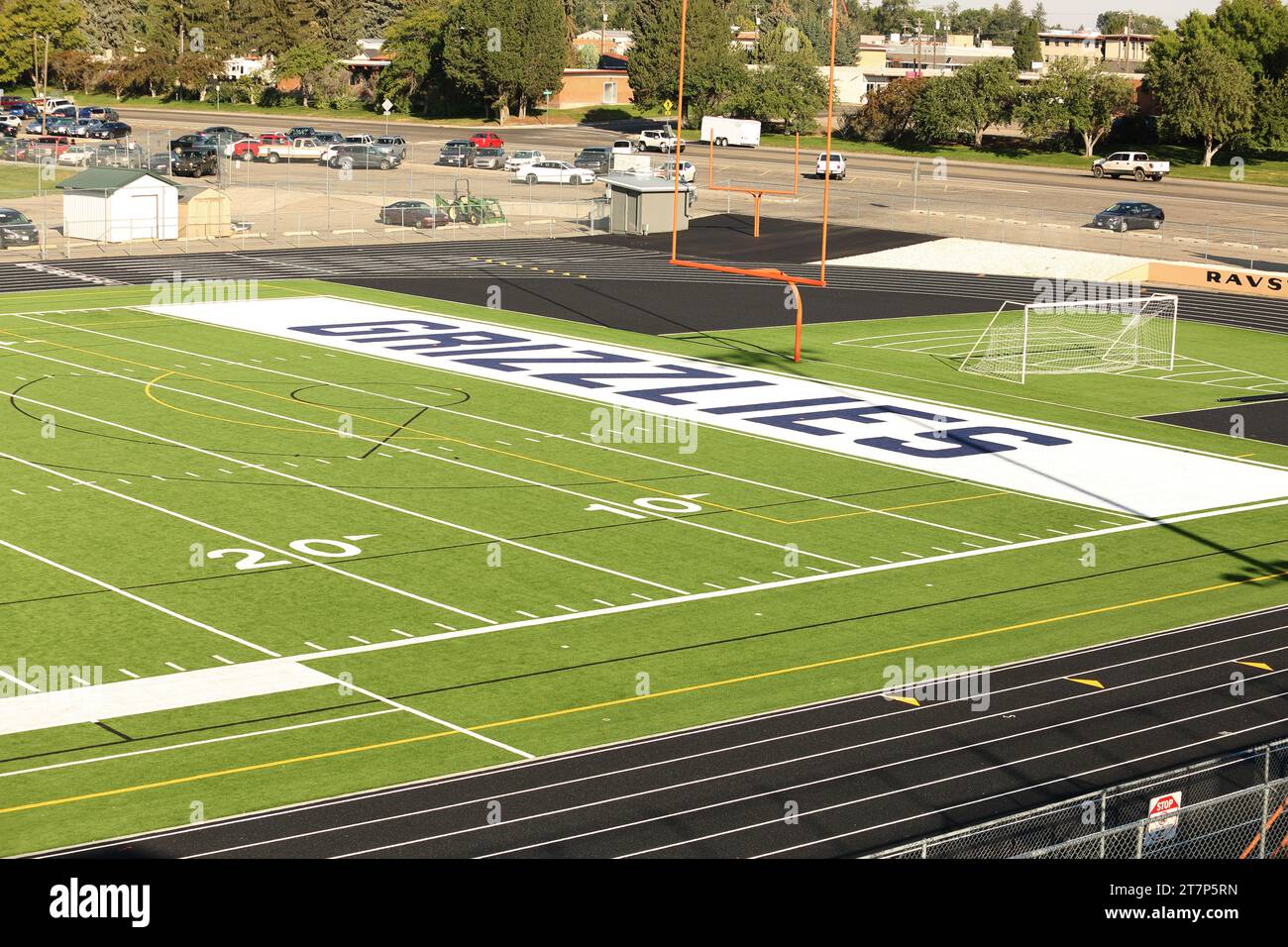 A newly renovated high school football field, with new artificial turf