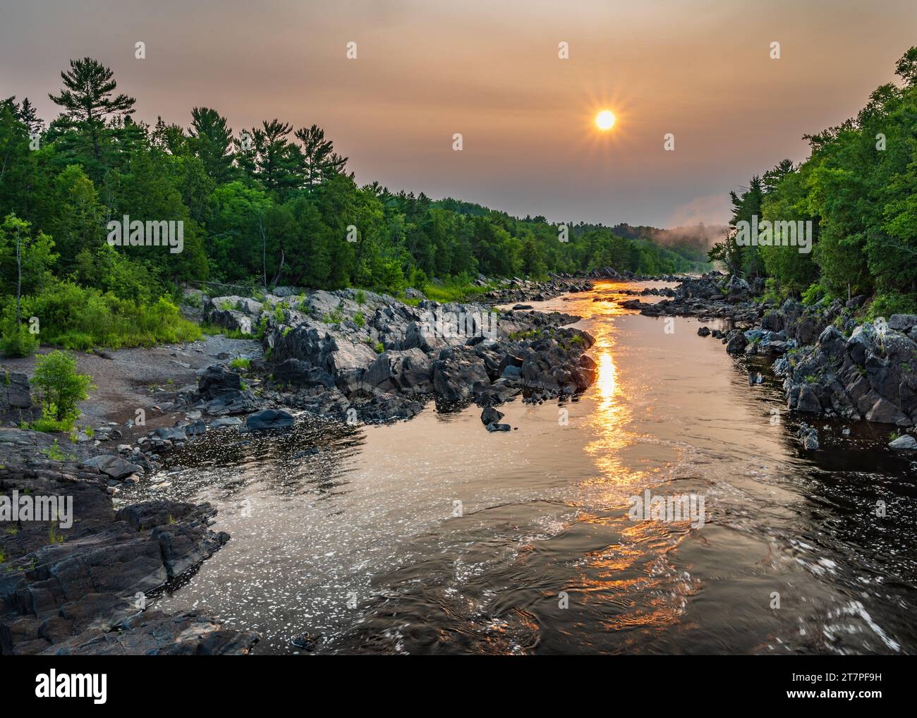 Sun Rises Over the St. Louis River in Jay Cooke State Park  in Minnesota Stock Photo