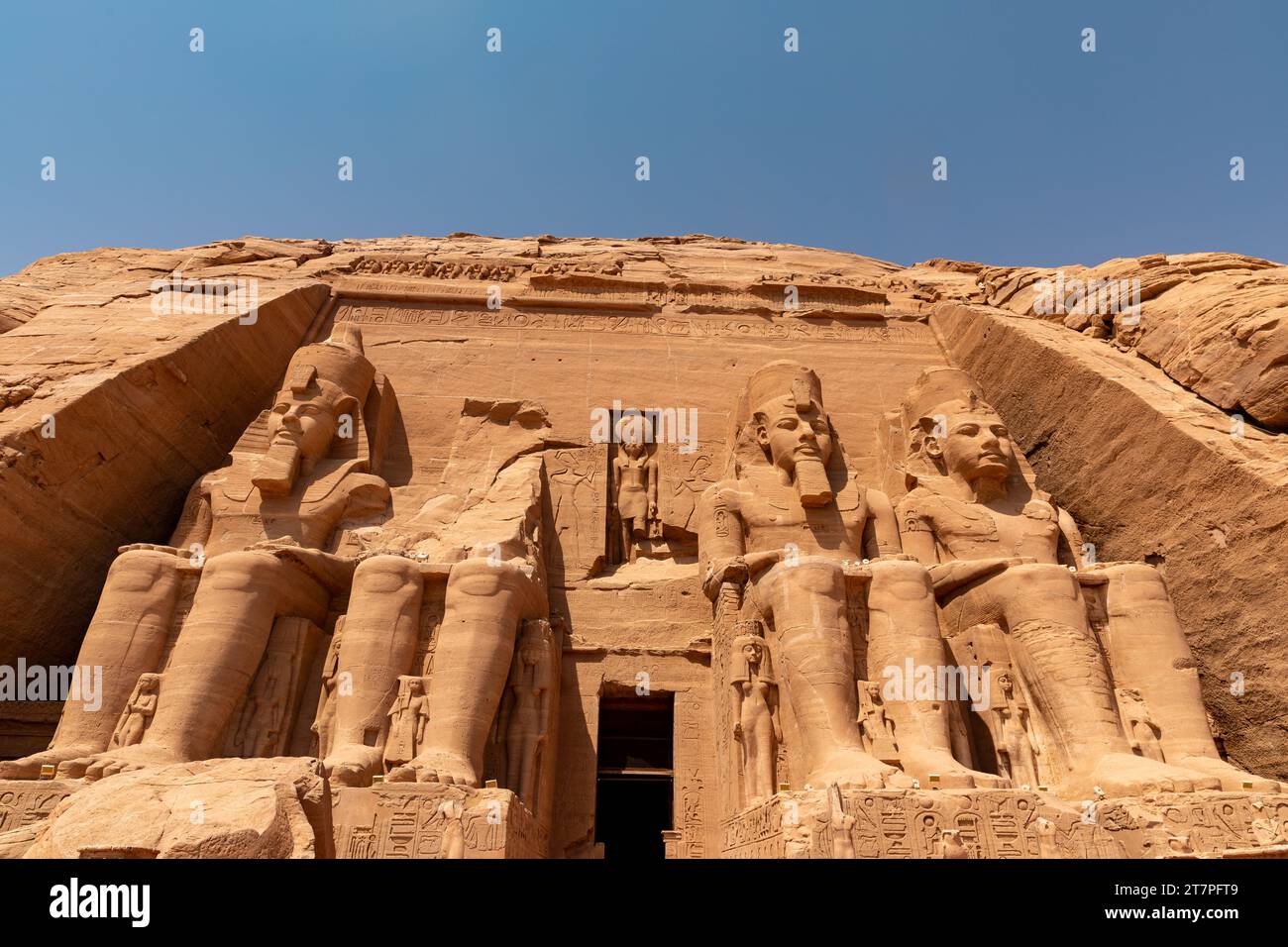 Giant sandstone statues on the exterior of Abu Simbel temple ancient historical UNESCO heritage site build by King Ramses II Stock Photo