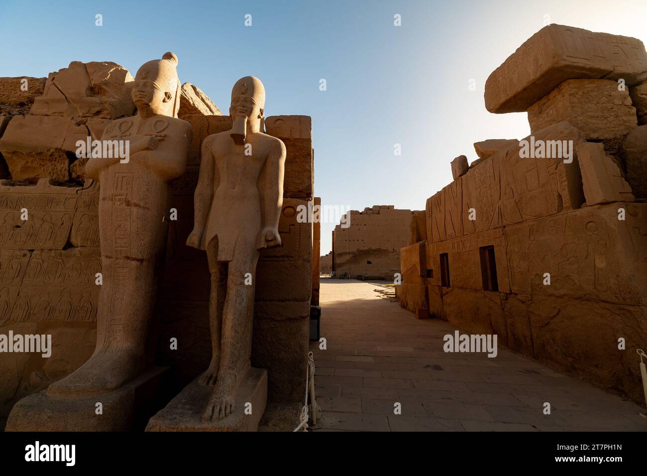 Large stone pharo statue in the ancient ruins of Karnak Temple complex ...