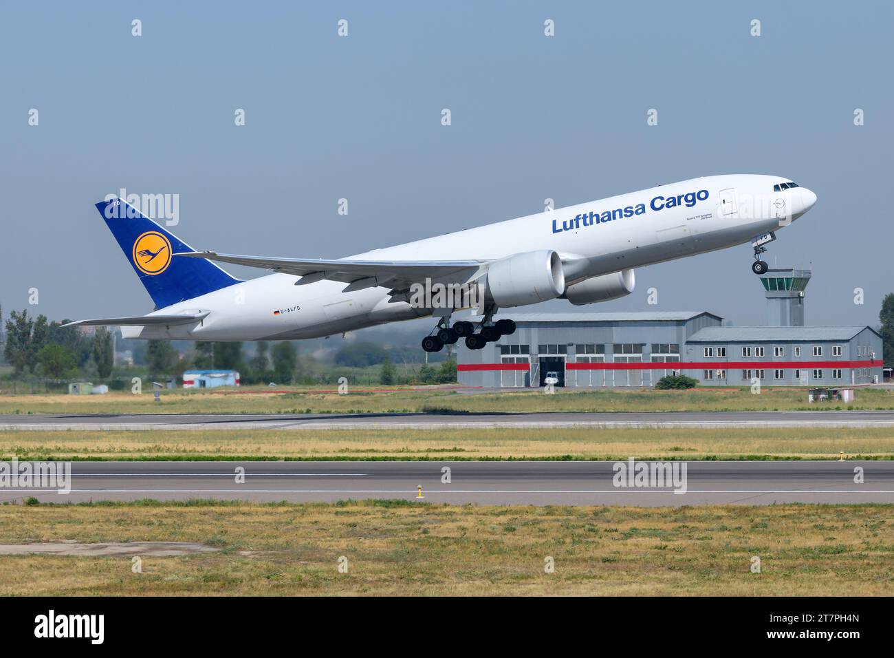 Lufthansa Cargo Boeing 777F aircraft taking off. Airplane of model 777 for freigther transport of Lufthansa Cargo. Plane of LH Cargo departing. Stock Photo