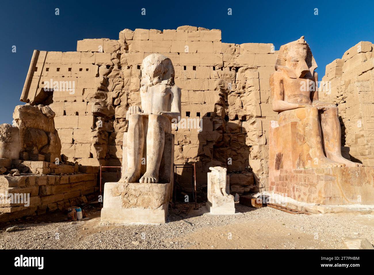 Large stone pharo statue in the ancient ruins of Karnak Temple complex in the Egyptian Desert city of Luxor Stock Photo