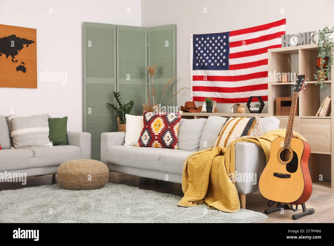 Interior of stylish living room with hanging USA flag Stock Photo - Alamy
