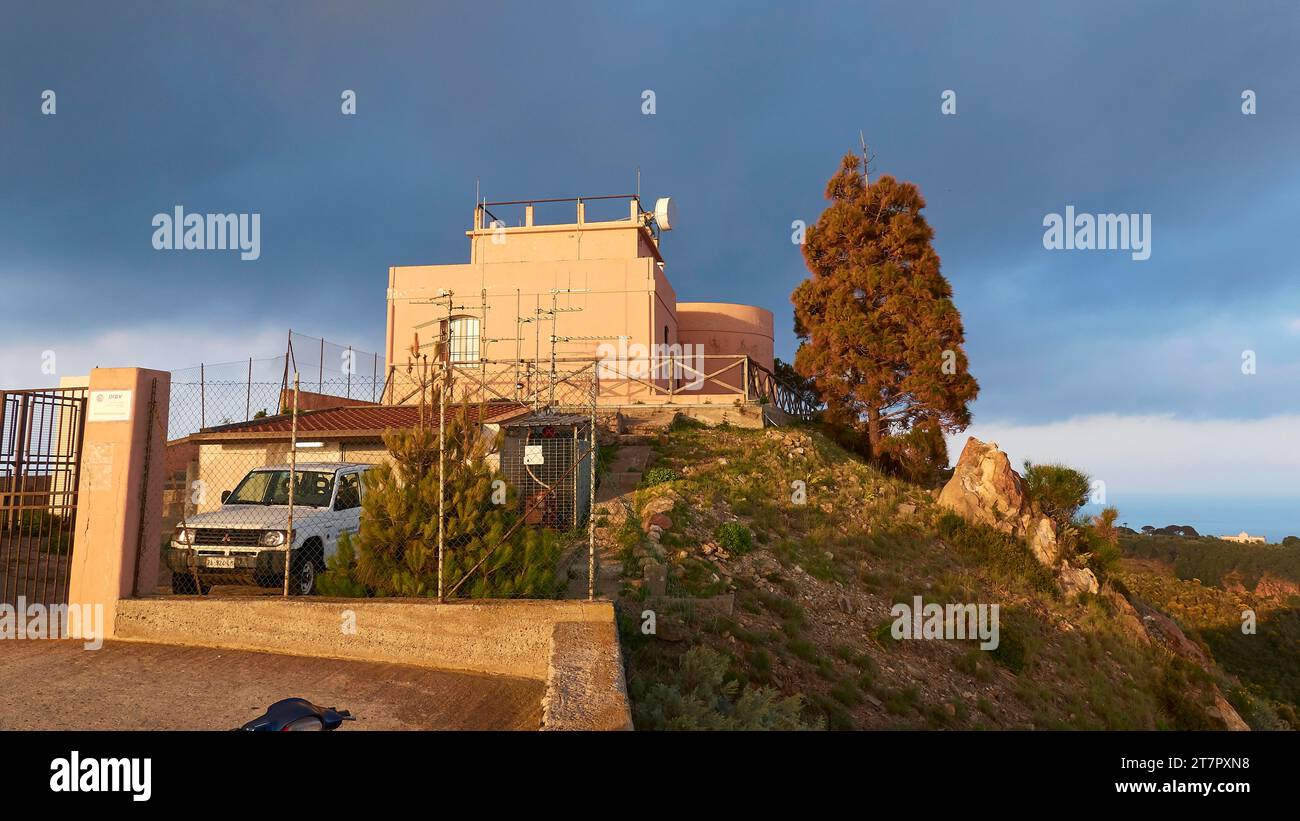 Golden evening light, Osservatorio Geofisico di Lipari, observatory, car, Lipari, Lipari Islands, Aeolian Islands, Sicily, Italy Stock Photo
