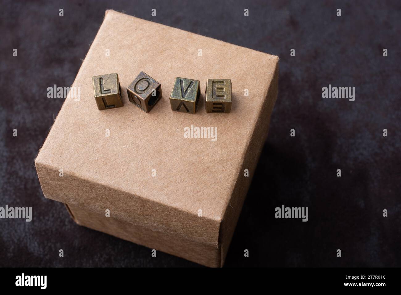 The word love with metal letters on box as love concept Stock Photo