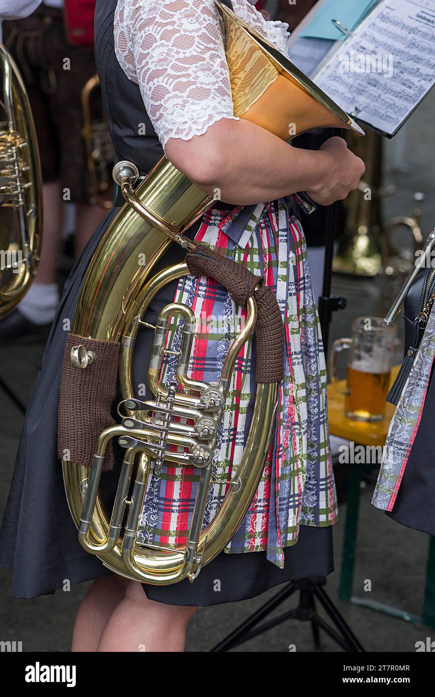 Musician with her tuba under her arm, at the traditional Lindentanzfest ...