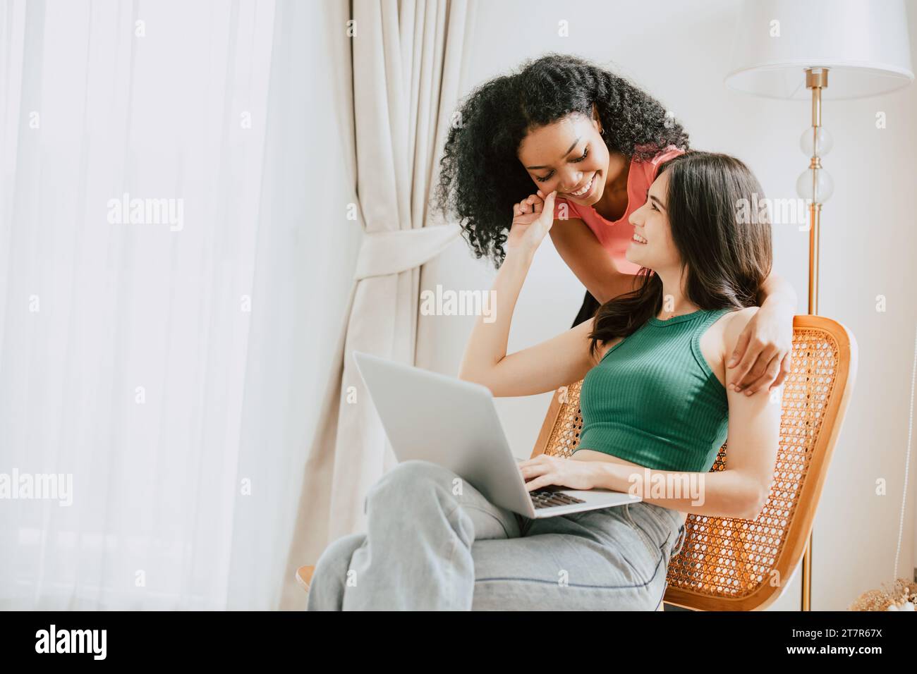 LGBT women lover living together with laptop computer modern technology device for equality lifestyle concept Stock Photo