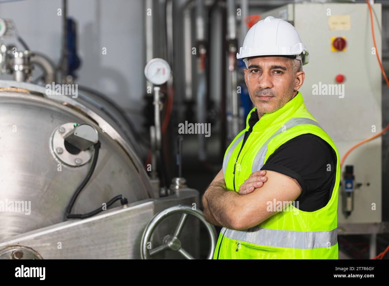 Portrait senior engineer male working in gas pipe boiler heavy industry factory smart confident Stock Photo