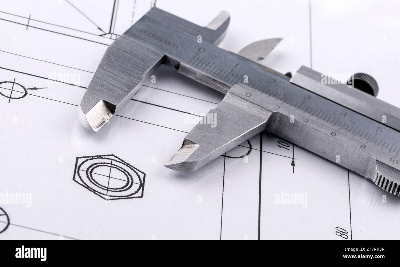 The Old metal caliper and engineering drawing. Close up Stock Photo - Alamy