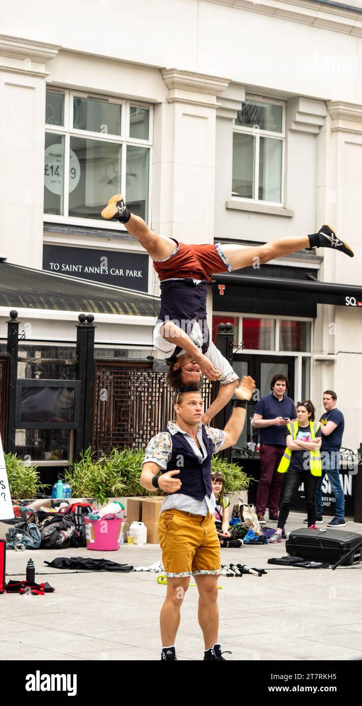 Belfast, County Antrim, Northern Ireland, May 05 2018 - Festival of Fools performing acrobats in St Annes Square Belfast Stock Photo