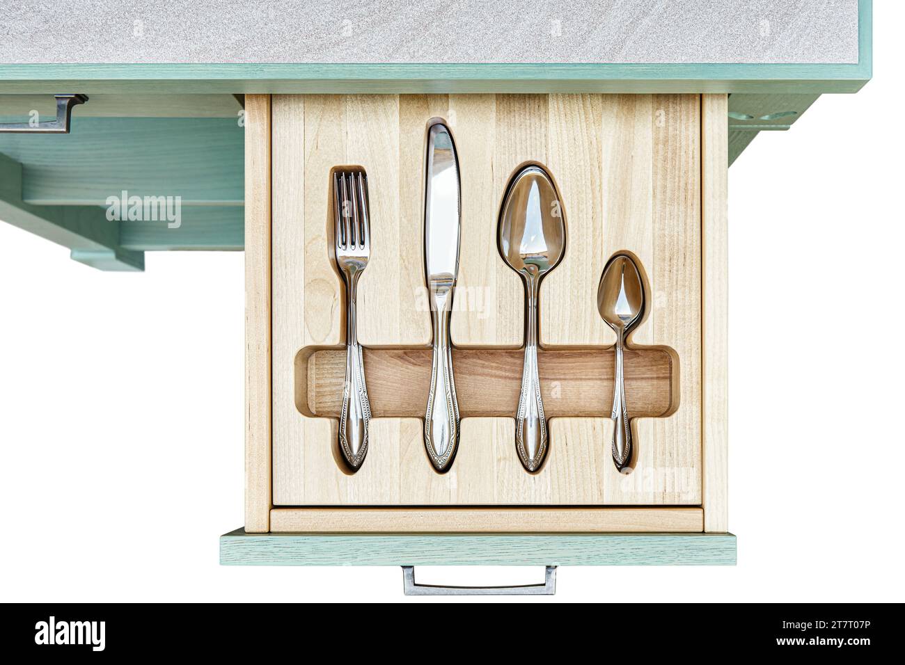 Shiny silverware in craved wooden tray in serving table drawer isolated