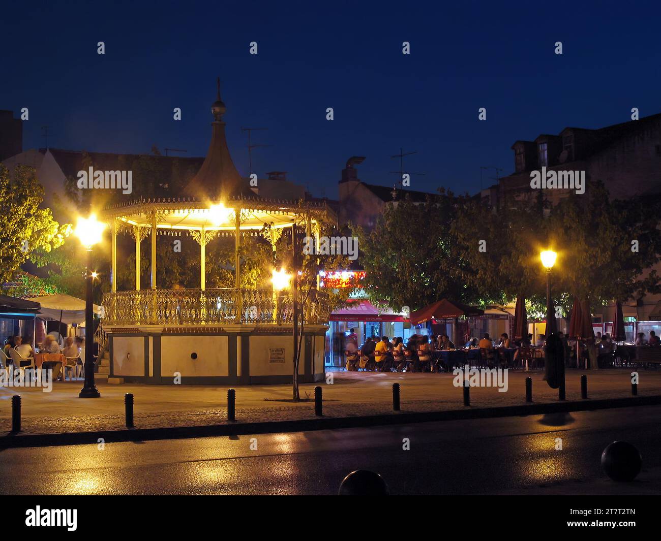 Seixal, Portugal. June 3, 2023: Bandstand in Amora by night with open air restaurants and bars in the square. Seixal, Portugal. Stock Photo