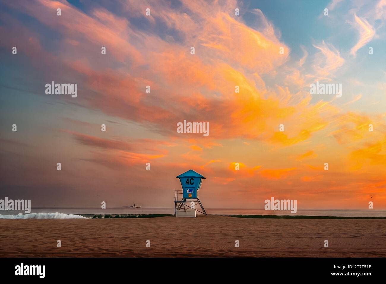 Lifeguard stand in front of sunset sky Stock Photo