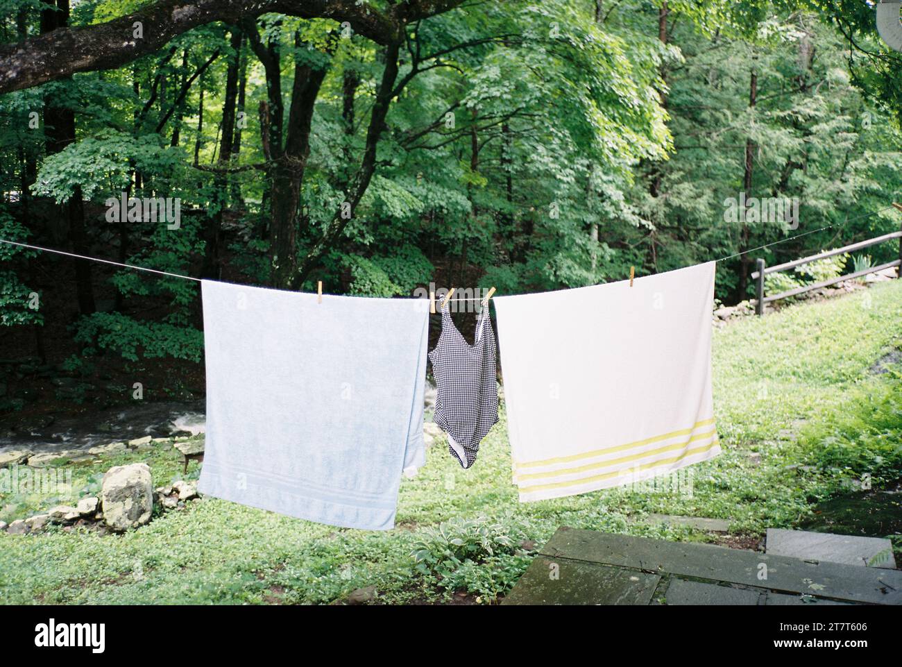 Vintage-style 35mm film photo of laundry and beachwear drying on Stock Photo