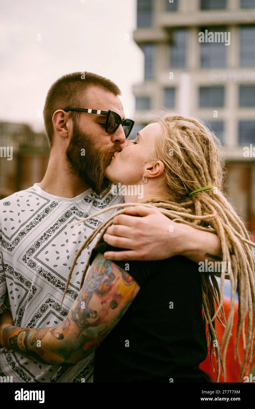 A young couple in love hugs and kisses. Stock Photo