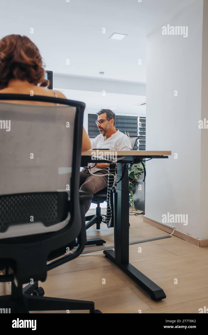 Confident Business Partners Analyzing Reports for Future Success Stock Photo