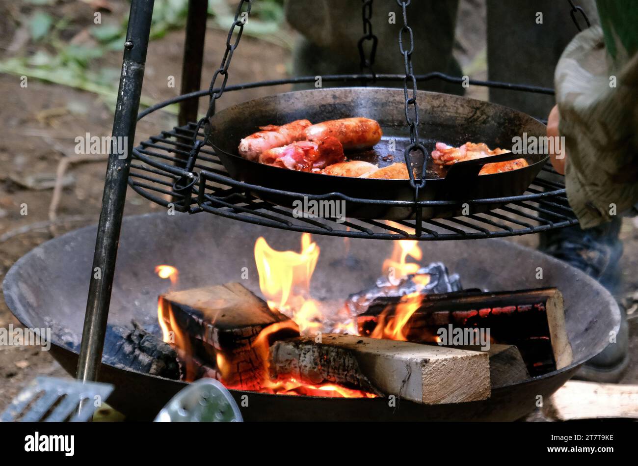 Breakfast cooking on outdoor fire. Stock Photo