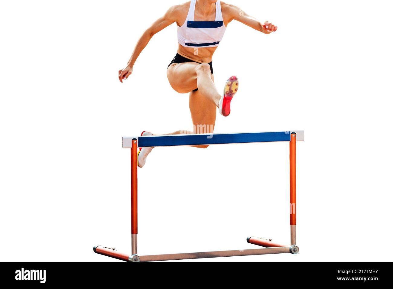 female athlete running 400 meters hurdles race in summer athletics
