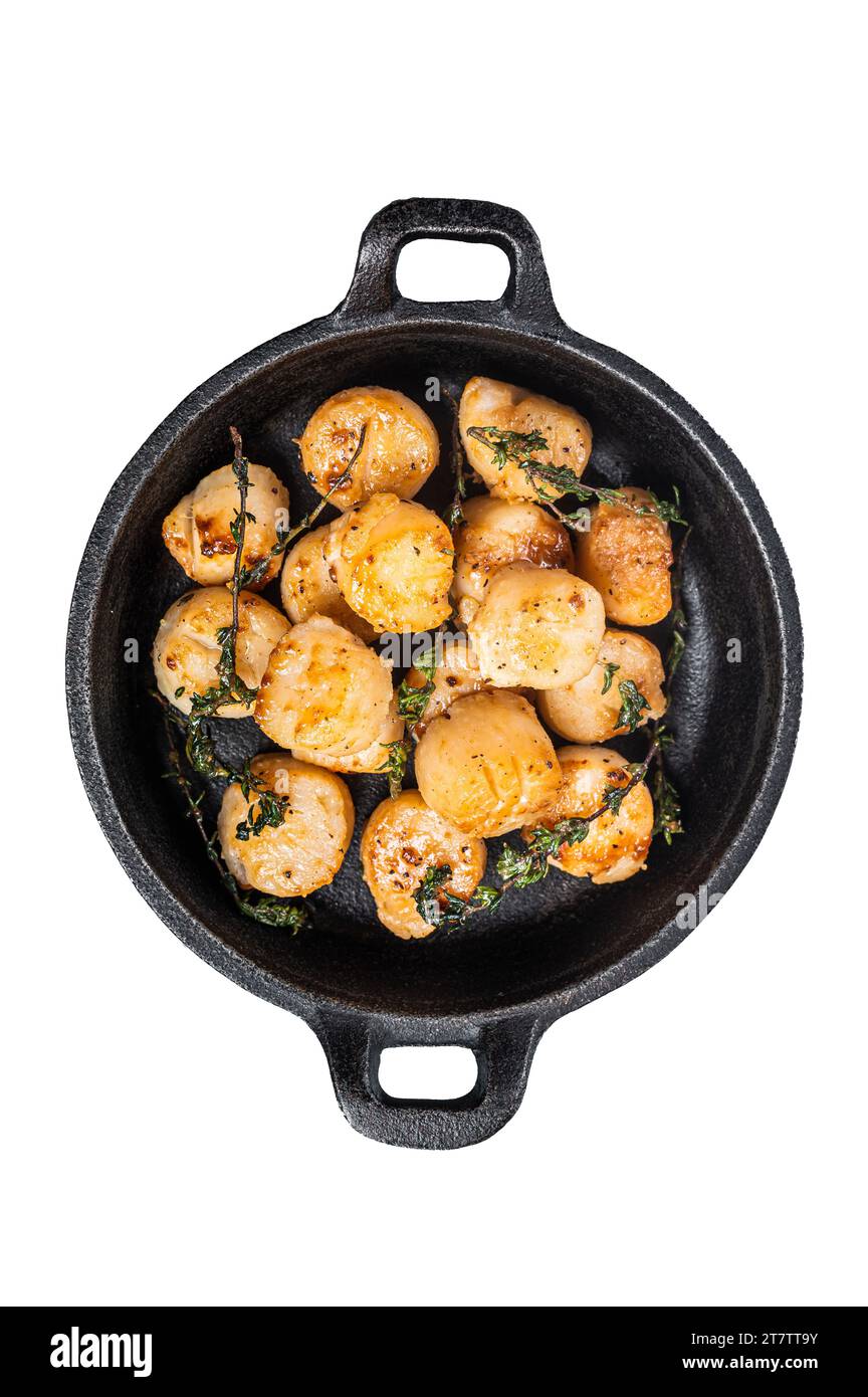 Scallops seared in garlic, thyme and butter served in cast iron skillet. Isolated, white