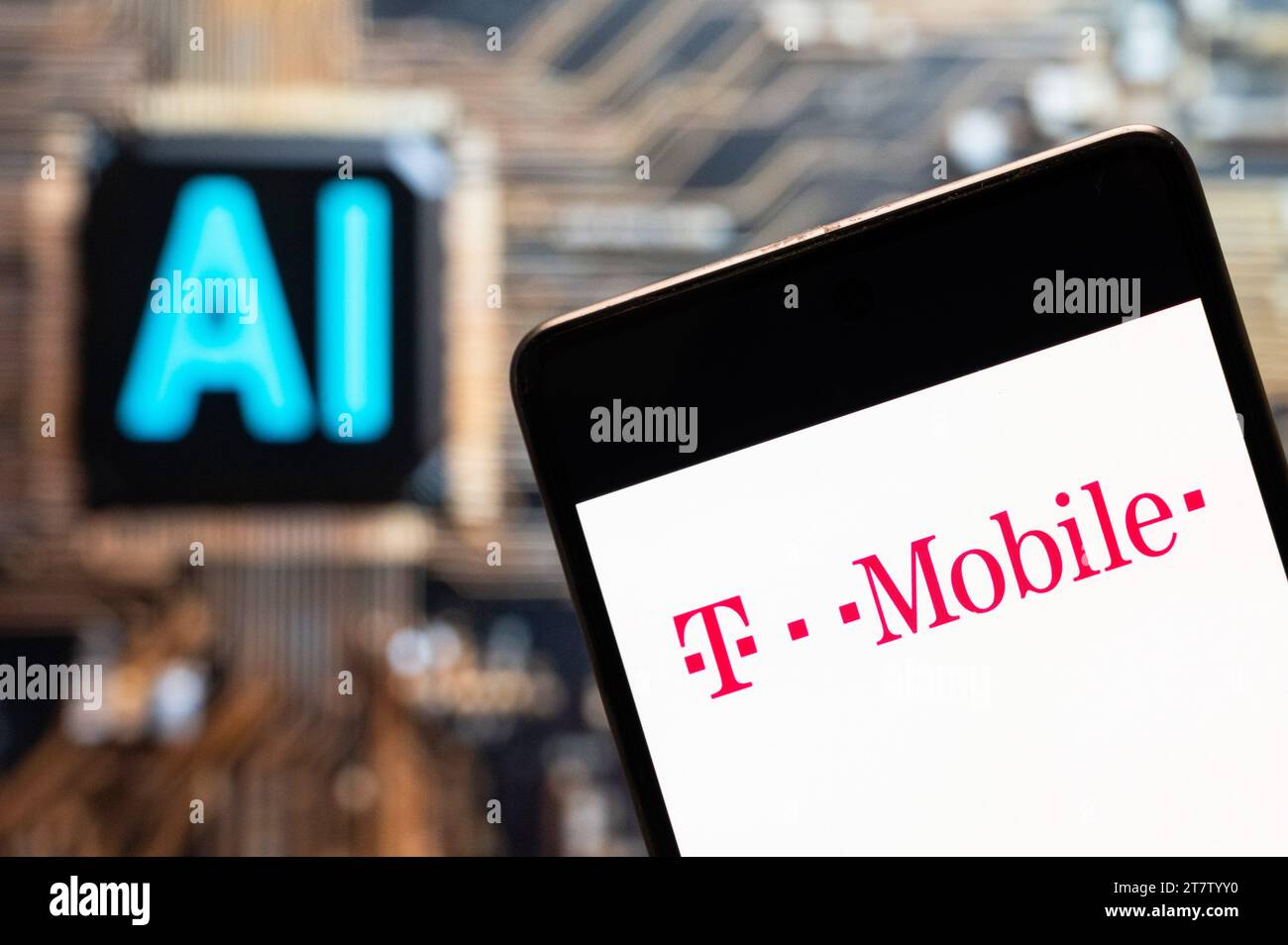 China. 3rd Nov, 2023. In this photo illustration, the German telecommunications company Deutsche Telekom AG, T-Mobile, logo seen displayed on a smartphone with an Artificial intelligence (AI) chip and symbol in the background. (Credit Image: © Budrul Chukrut/SOPA Images via ZUMA Press Wire) EDITORIAL USAGE ONLY! Not for Commercial USAGE! Stock Photo