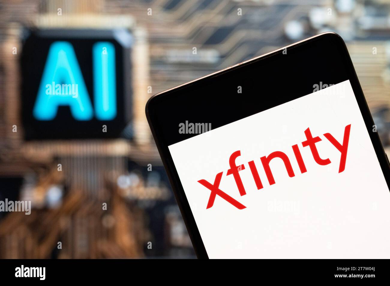 China. 3rd Nov, 2023. In this photo illustration, the American Internet television service provider owned by Comcast, Xfinity (NASDAQ: CMCSA) logo seen displayed on a smartphone with an Artificial intelligence (AI) chip and symbol in the background. (Credit Image: © Budrul Chukrut/SOPA Images via ZUMA Press Wire) EDITORIAL USAGE ONLY! Not for Commercial USAGE! Stock Photo