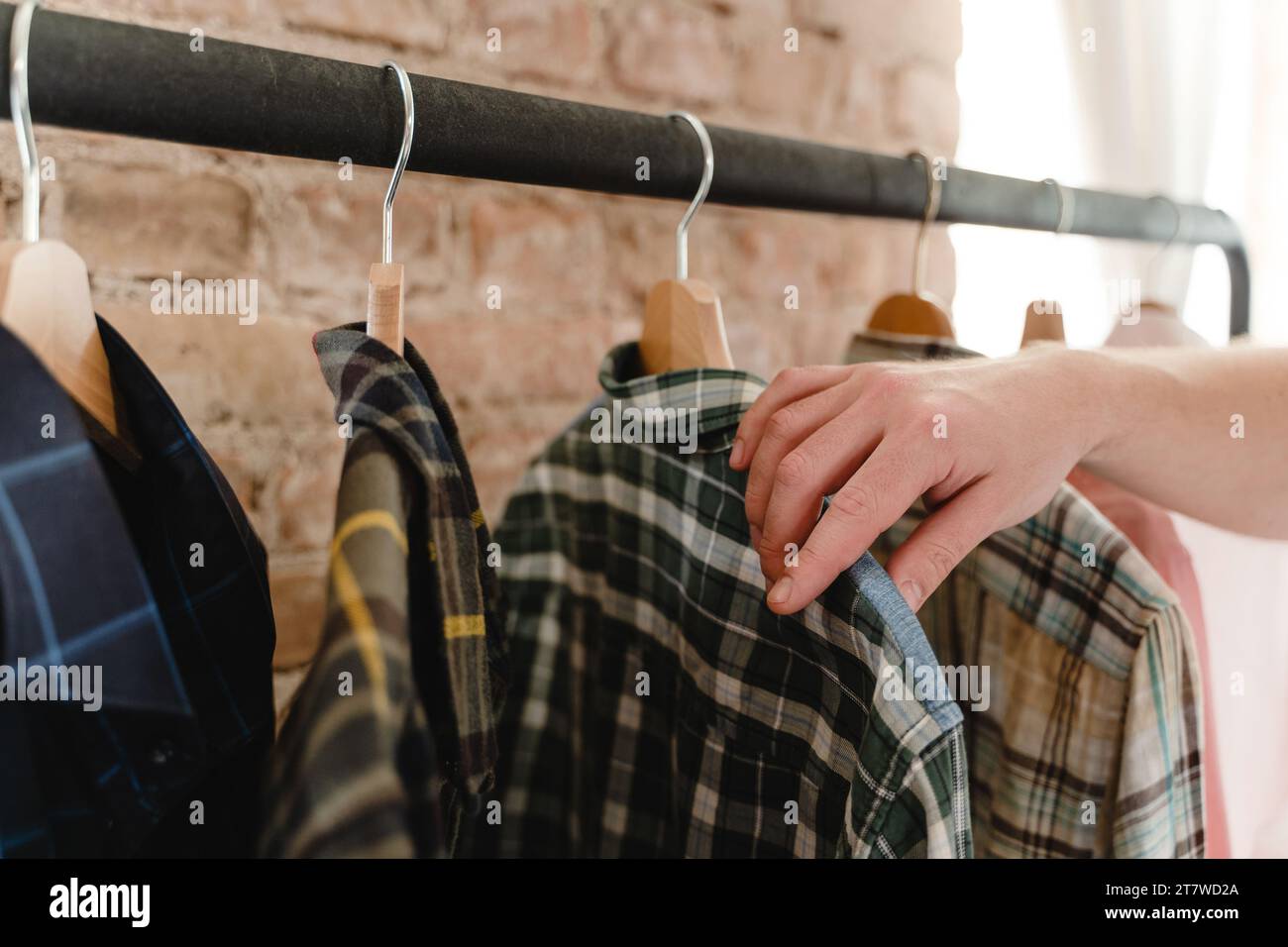 Man Browsing Racks Customer in thrift shop browsing hi-res stock photography and images ...