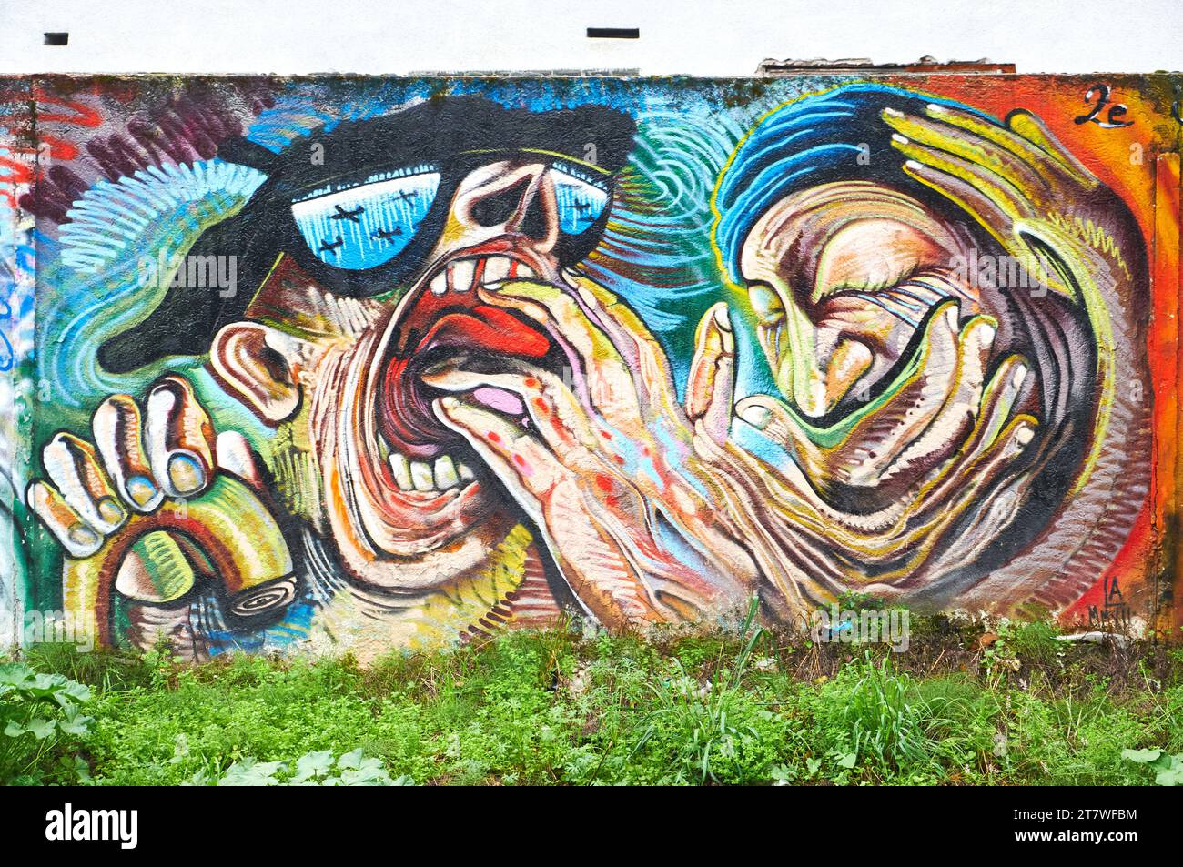 A dazzling graffiti masterpiece, bursting with colors and imagination, transforms the urban