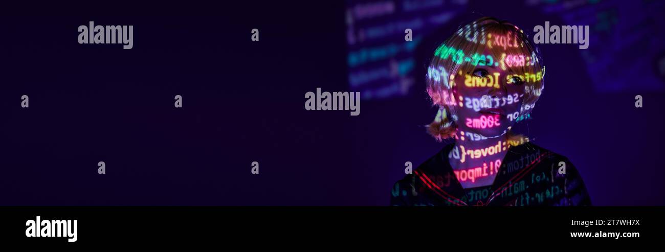young cosplay woman in colorful neon programming symbols projection on ...