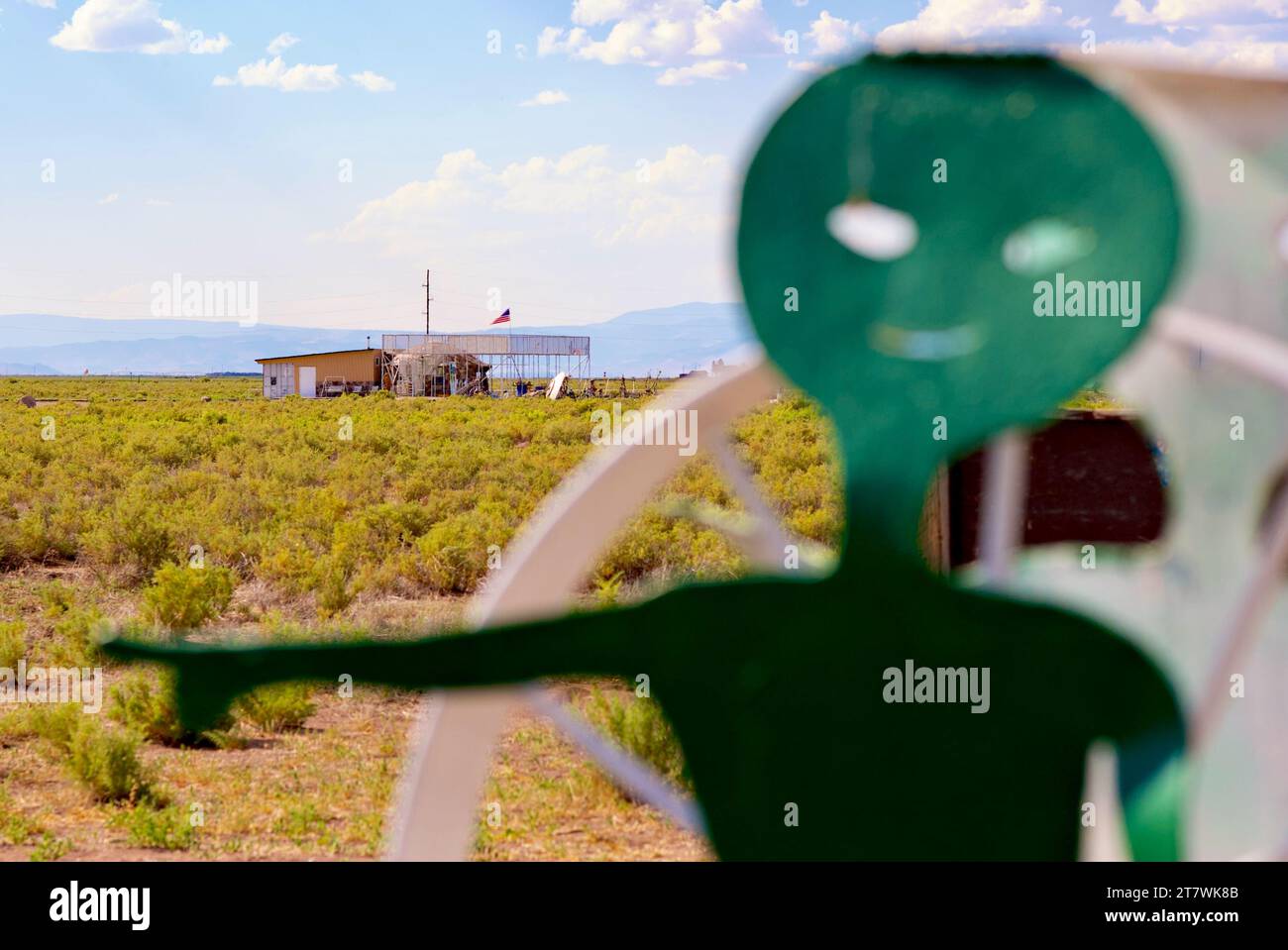 Hooper, Colorado, USA - July 21, 2023: An 'alien' welcomes visitors to the UFO Watchtower, a unique roadside attraction in the San Luis Valley. Stock Photo