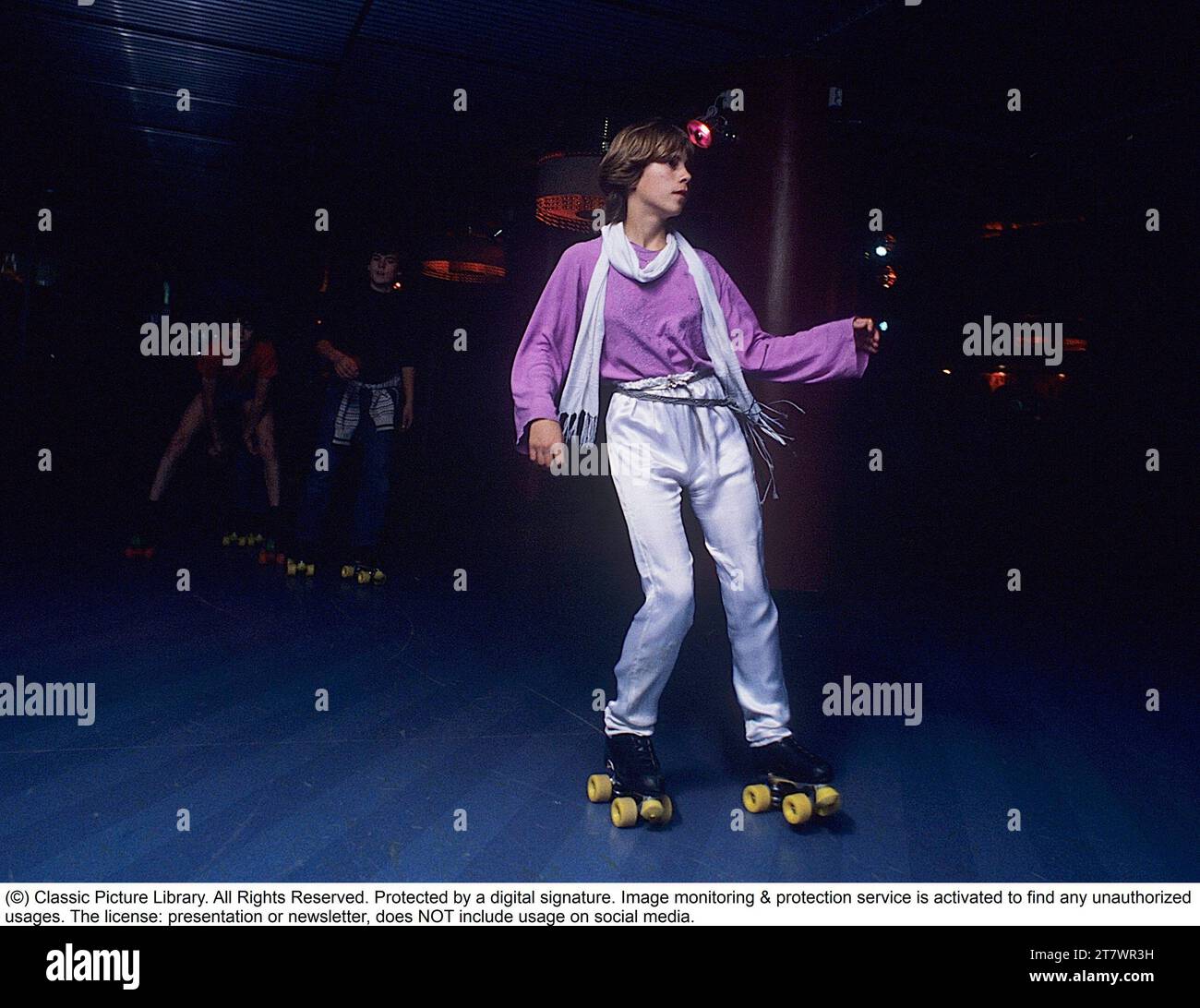 Roller skate fun in the 1970s. Interior of a roller disco with people