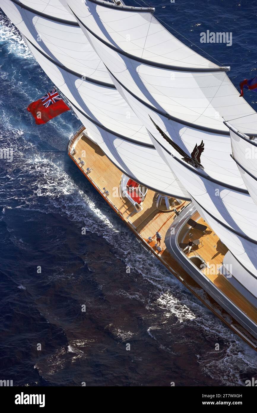 Helicopter photo of 88m super sailing yacht Maltese Falcon under full sail showing the teak decks. Stock Photo