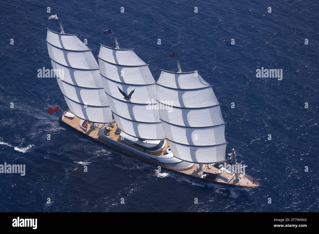 Helicopter photo of 88m super sailing yacht Maltese Falcon under full sail showing the teak decks. Stock Photo